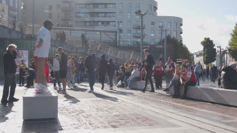 Fan-Dancing-Outside-The-Emirates-Stadium-Home-Ground-Arsenal-Football-Club-London-With-Supporters-On-Match-Day-1